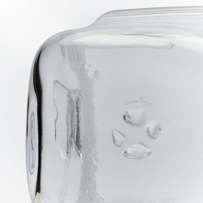 White ice bucket with condensation and frost on exterior surface, featuring curved handles and brand name etched on side.