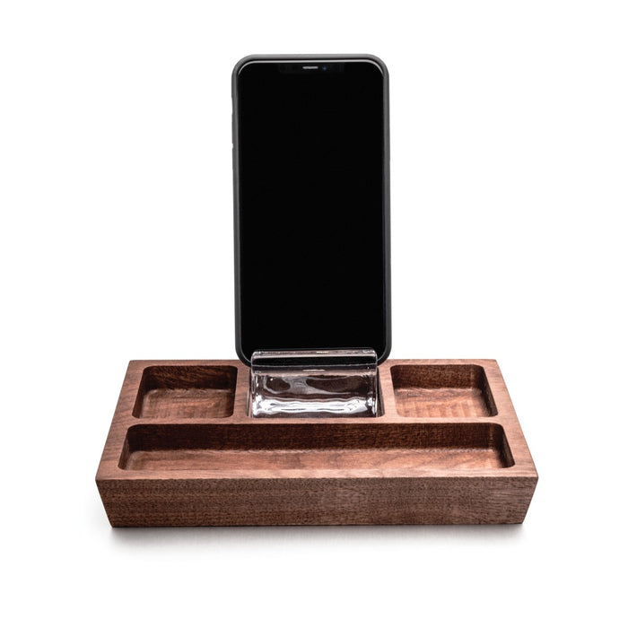 Walnut wood caddy with smartphone stand and multiple compartments for storage.