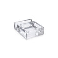 Clear acrylic phone valet with metal tray and handle for organizing personal items.