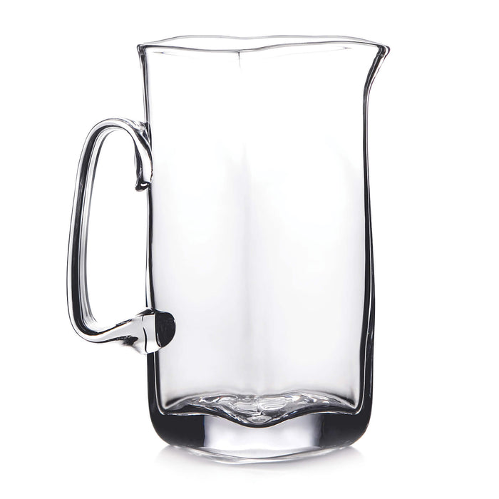 Clear glass pitcher with curved sides, a handle on the left, and a pouring spout at the top.