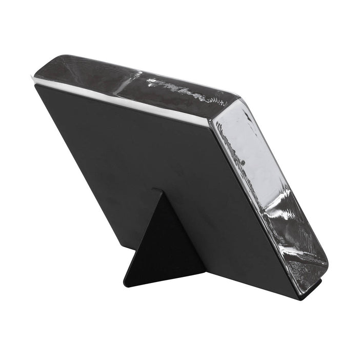 Black square photo block with white trim and integrated easel stand for displaying photographs.