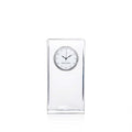 Tall rectangular clear glass clock with round dial face and black hands, Simon Pearce brand marking visible.