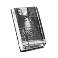 Clear acrylic photo block with black and white canal street scene featuring ornate railing, displayed at an angle.