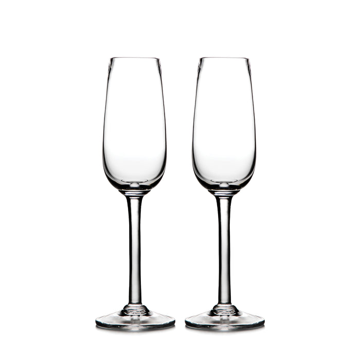 Two clear glass champagne flutes with tapered bowls and stem bases.