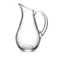 Clear glass pitcher with curved body, angled spout, and large handle.