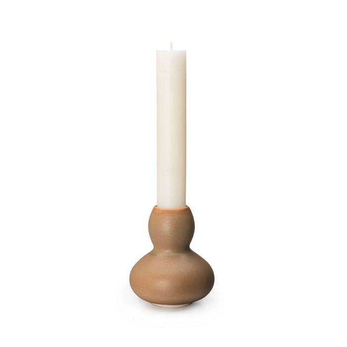 Ceramic candlestick with brown bulbous base and cylindrical column holding a cream pillar candle.