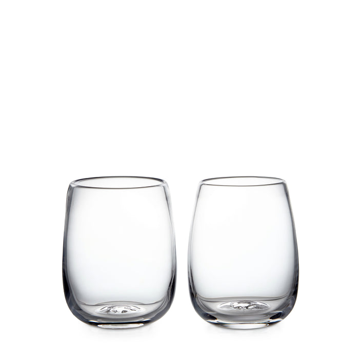 Two clear glass tumblers with curved sides and embossed base design.