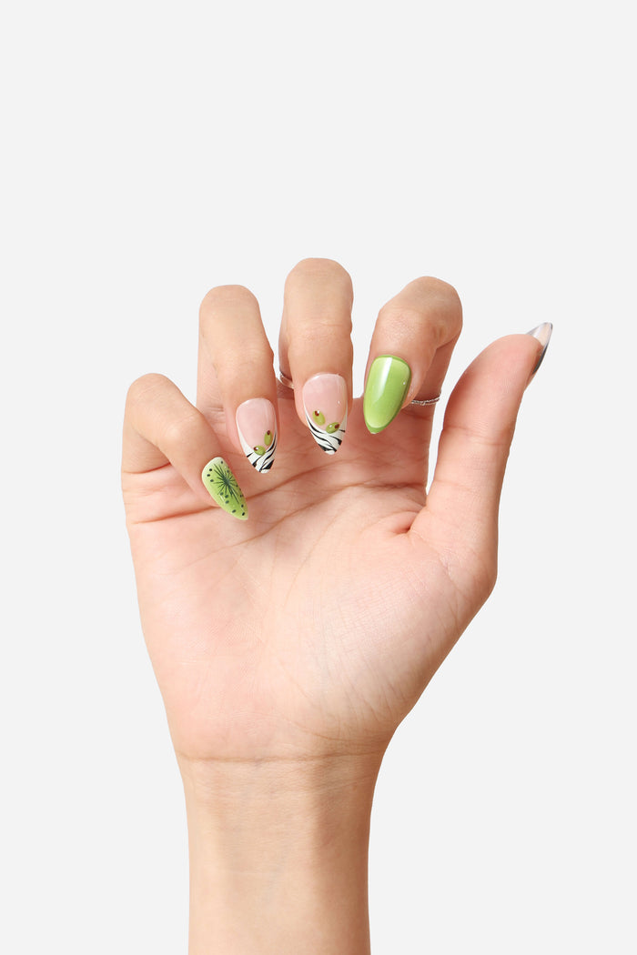 Short almond press-on nails with green zebra print and floral accents